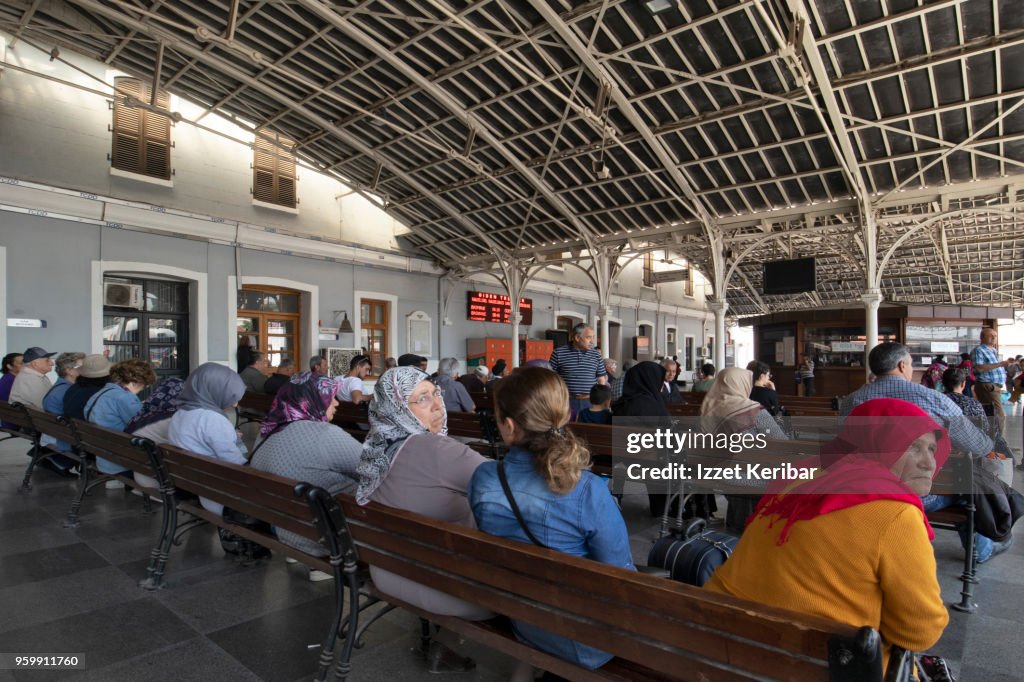 Women seated at Basmane train station Izmir Turkey