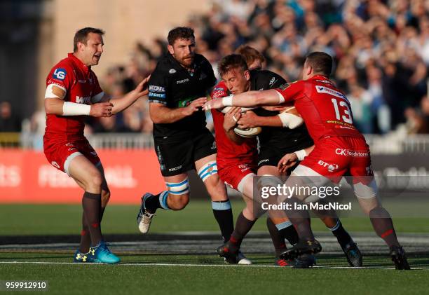 Matt Fagerson of Glasgow Warriors is tackled by Rhys Patchell of Scarlets during the Guinness Pro14 Semi Final match between Glasgow Warriors and...