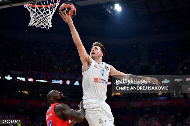 Real Madrid's Slovenian Luka Doncic goes for the basket past CSKA's US center Othello Hunter during the Euroleague Final Four second semifinal match...