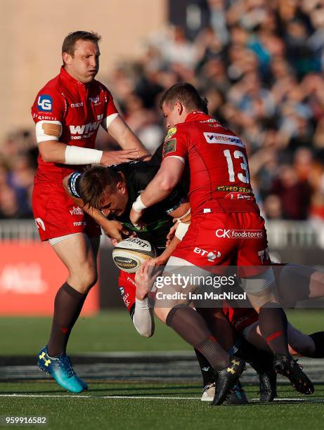 Matt Fagerson of Glasgow Warriors is tackled by Rhys Patchell of Scarlets during the Guinness Pro14 Semi Final match between Glasgow Warriors and...