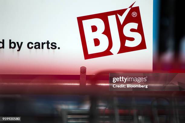 Signage is displayed on a shopping cart stand outside a BJ's Wholesale Club Holdings Inc. Location in Miami, Florida, U.S., on Thursday, May 17,...