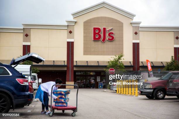 Customer loads groceries into the trunk of a vehicle outside a BJ's Wholesale Club Holdings Inc. Location in Miami, Florida, U.S., on Thursday, May...