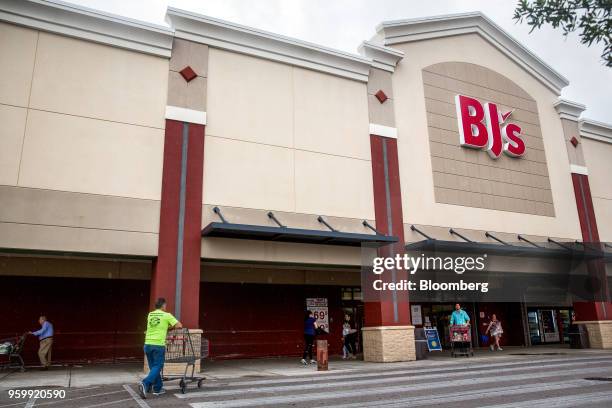 Customers stand outside a BJ's Wholesale Club Holdings Inc. Location in Miami, Florida, U.S., on Thursday, May 17, 2018. The warehouse-club chain,...