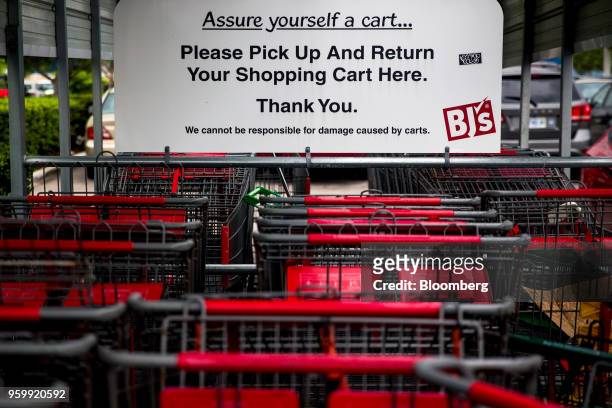 Shopping carts sit outside a BJ's Wholesale Club Holdings Inc. Location in Miami, Florida, U.S., on Thursday, May 17, 2018. The warehouse-club chain,...