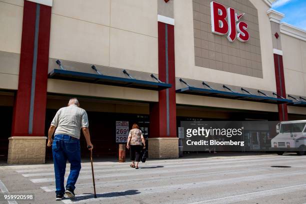 Customers walk towards the entrance of a BJ's Wholesale Club Holdings Inc. Location in Miami, Florida, U.S., on Friday, May 18, 2018. The...
