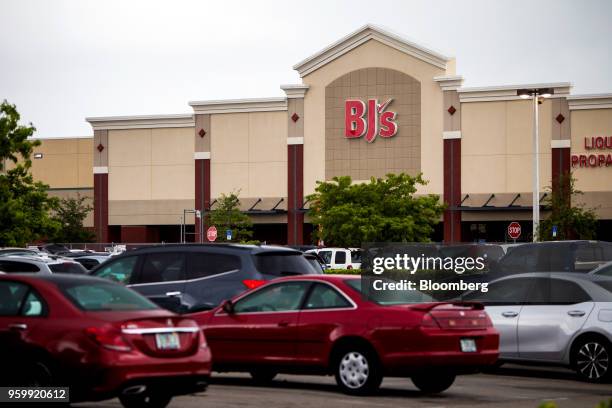 Vehicles sit parked outside a BJ's Wholesale Club Holdings Inc. Location in Miami, Florida, U.S., on Thursday, May 17, 2018. The warehouse-club...