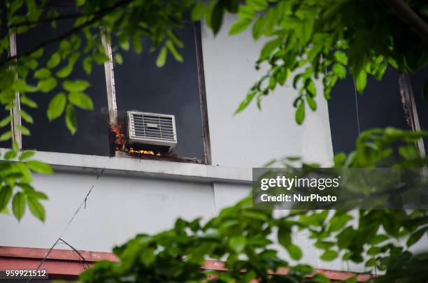 An airconditioning unit catches fire in Binondo, Manila, Philippines, on 18 May 2018. A fire of still unknown origin broke out at a residential and...