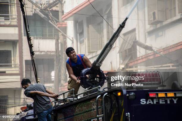 Firefighter puts out the fire that broke out at Wellington Building using a water cannon in Binondo, Manila, Philippines, on 18 May 2018. A fire of...