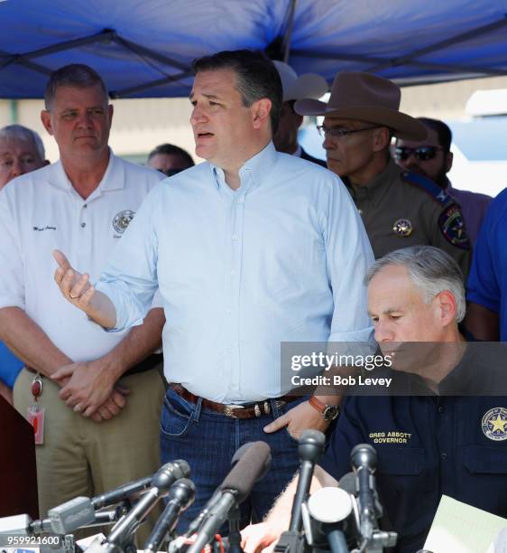 Sen. Ted Cruz speaks as Texas Gov. Greg Abbott and Galveston County Judge Mark Henry look on speaks during a press conference about the shooting...