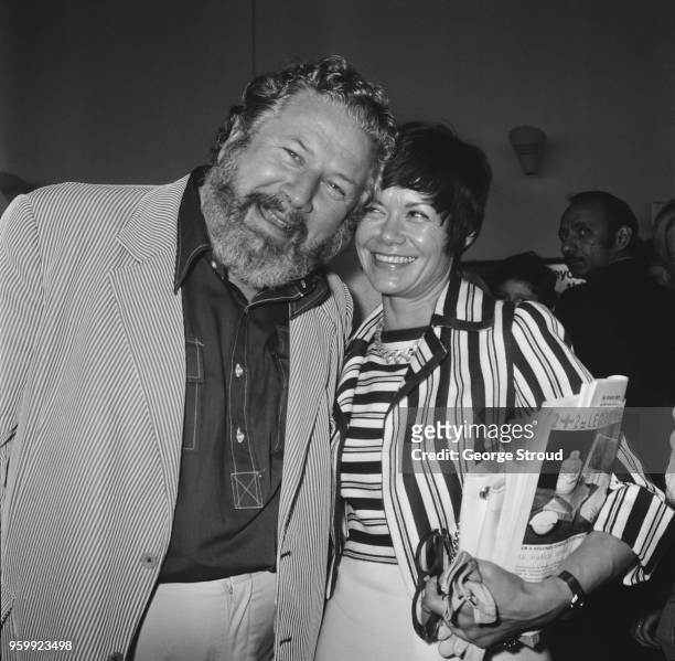 English actor and writer Peter Ustinov pictured with his wife Helene du Lau d'Allemans at Heathrow airport in London on 10th July 1972.