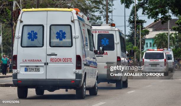 Ambulances rush through the streets of Havana after a Cubana de Aviacion aircraft crashed after taking off from the Jose Marti international airport...