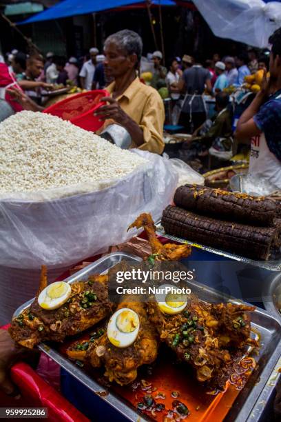 Bangladeshi vendor sells Iftar at chawkbazar in the capital Dhaka, Bangladesh on the first day of Muslim fasting month Ramadan on Friday, May 18,...