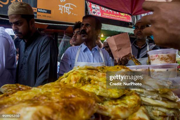 Bangladeshi vendor sells Iftar at chawkbazar in the capital Dhaka, Bangladesh on the first day of Muslim fasting month Ramadan on Friday, May 18,...