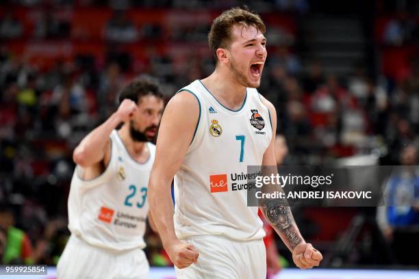 Real Madrid's Slovenian Luka Doncic and Real Madrid's Spanish guard Sergio Llull react after scoring a point during the Euroleague Final Four second...