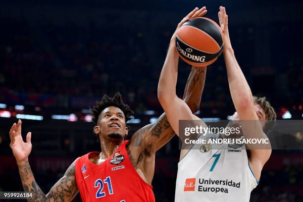 Moscow's US forward Will Clyburn fights for the ball with Real Madrid's Slovenian Luka Doncic during the Euroleague Final Four second semi-final...