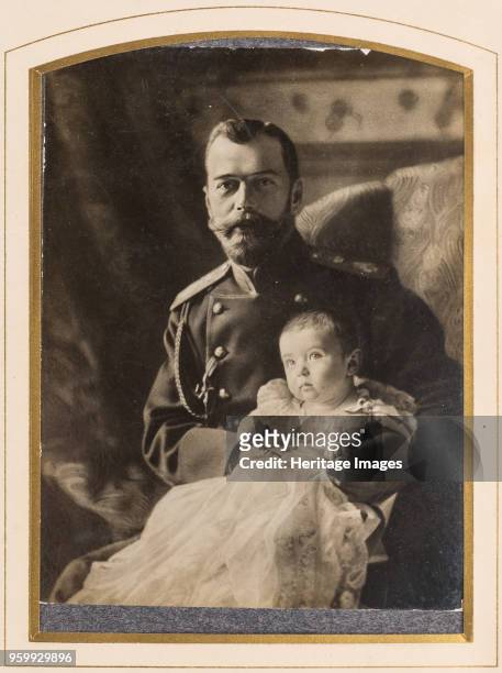 Tsar Nicholas II and Tsarevich Alexei, 1904. Private Collection. )