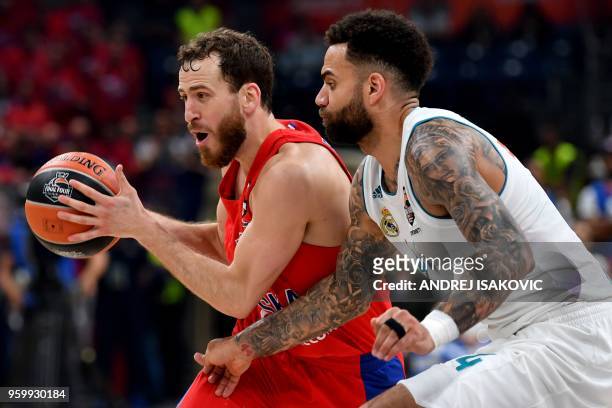 Moscow's Spanish guard Sergio Rodriguez fights for the ball with Real Madrid's Swedish forward Jeffery Taylor during the Euroleague Final Four second...