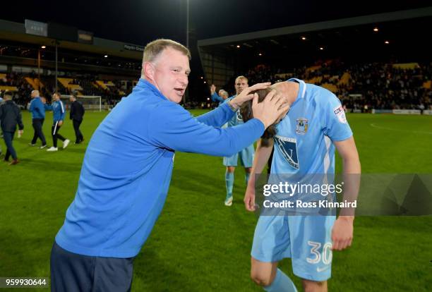 Mark Robins the manager of Coventry City celebrates with Tom Bayliss of Coventry after the Sky Bet League Two Play Off Semi Final:Second Leg between...