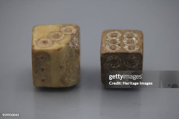 Pair of Roman dice made from carved bone, 1st century BC. Private Collection. )