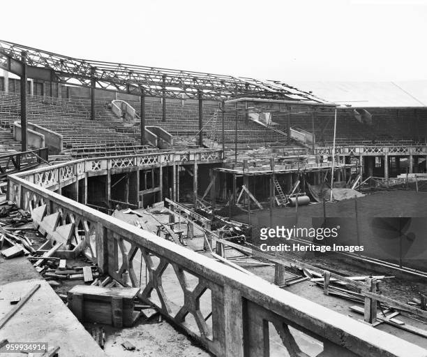 Centre Court under construction, All England Lawn Tennis and Croquet Club, Church Road, Wimbledon, London, 1922. The construction of tiered seating...