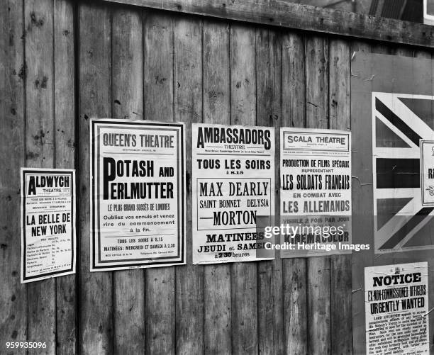 Playbills on a hoarding, London, World War I, 1914. Propaganda posters and adverts for propaganda films, in both English and French. Artist Adolph...