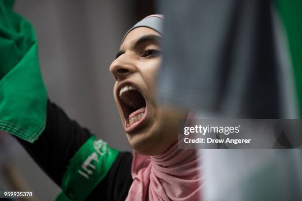 Female protestor shouts as members of the Palestinian community, fellow Muslims and their supporters rally in support of the Palestinian people in...