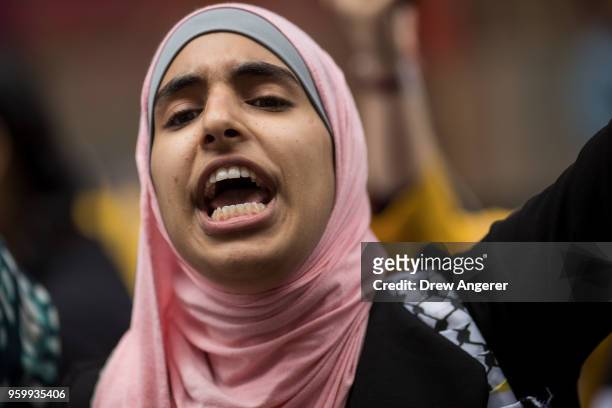 Female protestor shouts as members of the Palestinian community, fellow Muslims and their supporters rally in support of the Palestinian people in...