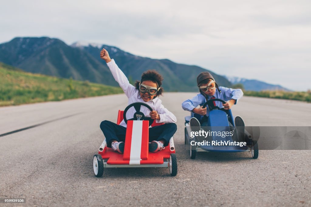 Young Business Boy and Girl Race Cars