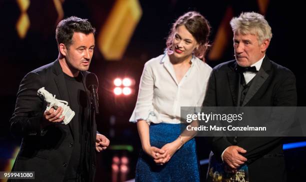 Christian Schochow , Paula Beer and Joerg Schuettauf seen during the Bayerischer Fernsehpreis show at Prinzregententheater on May 18, 2018 in Munich,...