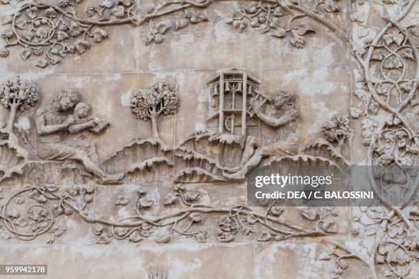 Naamah teaching a child to read and Tubal-Cain striking bells with a hammer; Enos son of Seth drawing with a compass, Stories of Genesis, bas-reliefs...