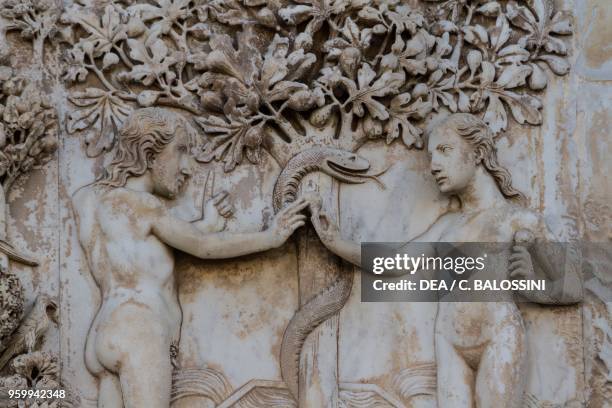 Eve offering the forbidden fruit to Adam, original sin, detail, Stories of Genesis, bas-reliefs by Lorenzo Maitani , first pillar, lateral facade of...