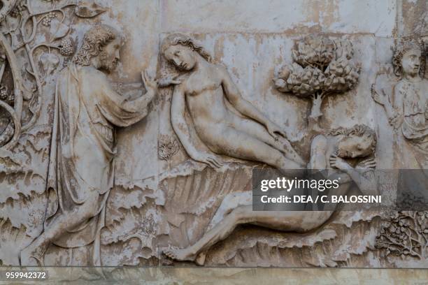 Creation of Eve, detail from the Stories of Genesis, bas-reliefs by Lorenzo Maitani , first pillar, lateral facade of Orvieto cathedral, Umbria,...