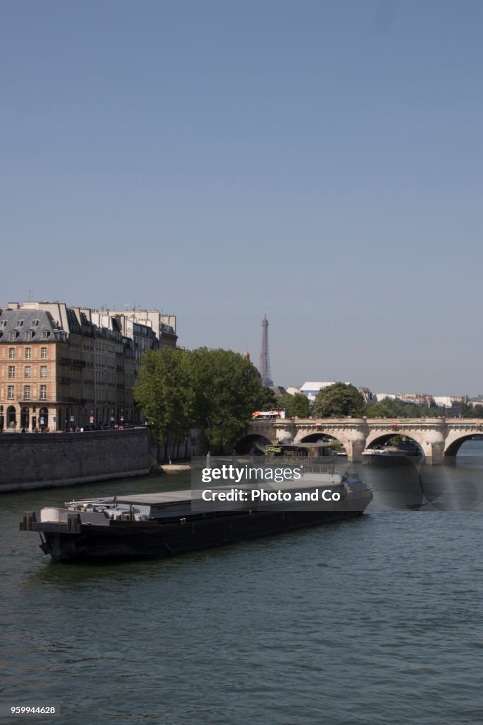 View of Paris, barge on the Seine in front of the Pont Neuf