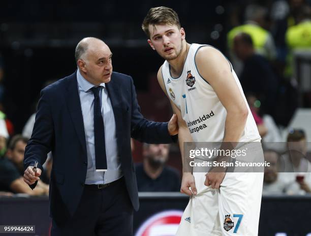 Head coach Pablo Laso speaks with Luka Doncic of Real Madrid during the Turkish Airlines Euroleague Final Four Belgrade 2018 Semifinal match between...