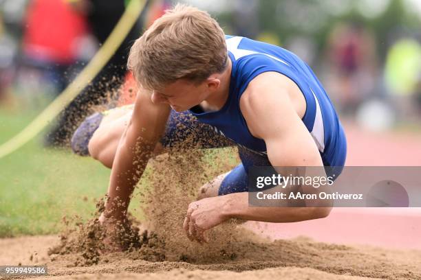 Cedar Ridge's Josh Jenkins falls forward in the triple jump pit at the Colorado State Track and Field Championships on Friday, May 18, 2018.