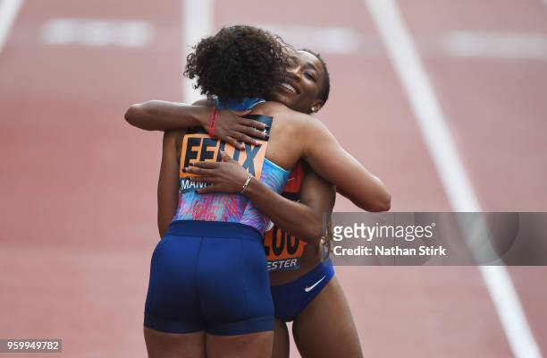 Marie Josee Ta Lou of Ivory Coast hugs Allyson Felix of the United States after winning the Women's 150m during the Great City Games on May 18, 2018...