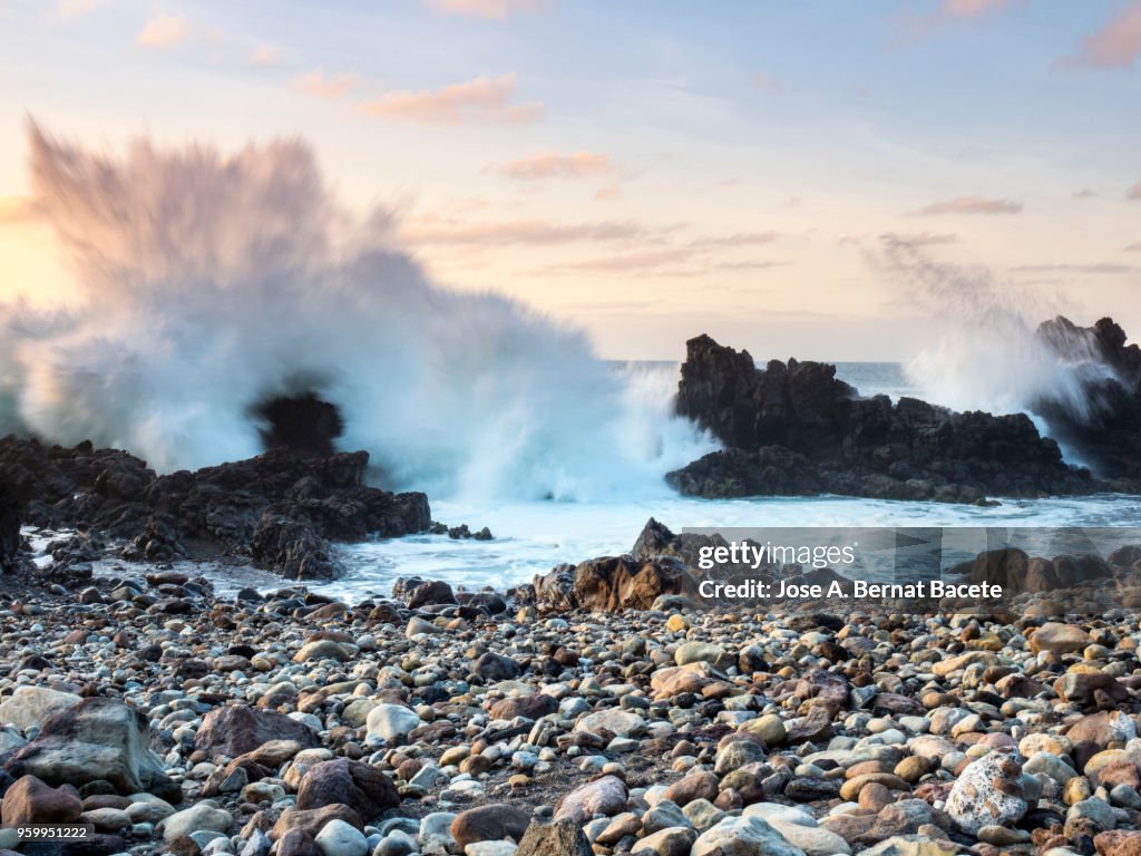 Impact of a great wave on the volcanic rocks of the coast or beach in Terceira Island in the Azores, Portugal.