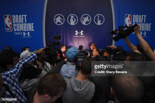 Trae Young is surrounded by reporters during Day Two of the NBA Draft Combine at Quest MultiSport Complex on May 18, 2018 in Chicago, Illinois. NOTE...