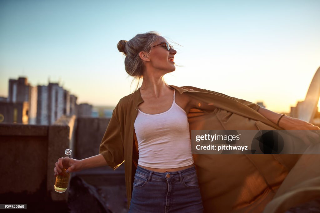 Portrait of woman at roof party.