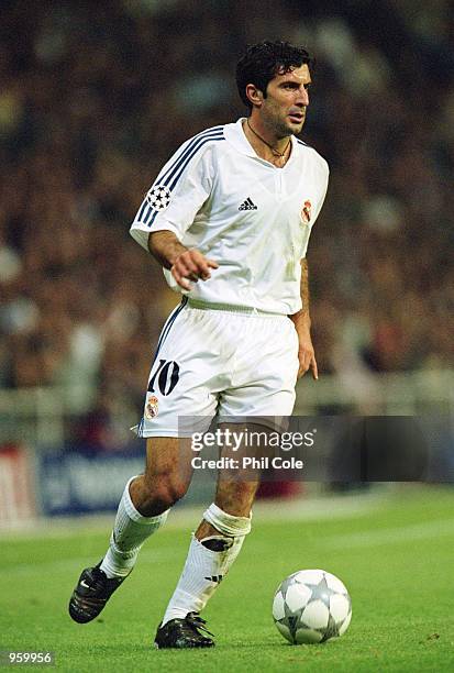 Luis Figo of Real Madrid runs with the ball during the UEFA Champions League Group A match against AS Roma played at the Bernabeu, in Madrid, Spain....