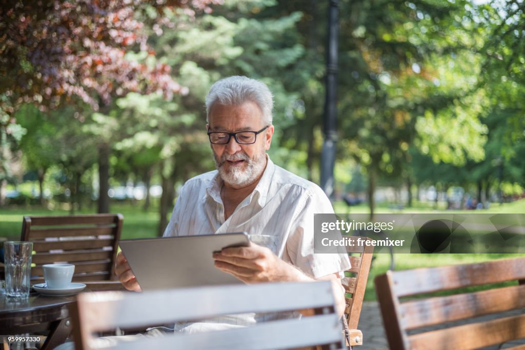 Senior man in cafe