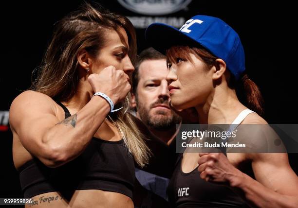 Poliana Botelho of Brazil and Syuri Kondo of Japan face off during during the UFC Fight Night weigh-in at Movistar Arena on May 18, 2018 in Santiago,...