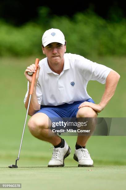 Brian Peccie of Washington & Lee lines up a put at the fourth hole during the Division III Men's Golf Championship at the Grandover Resort on May 18,...