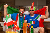 two real soccer fans supporting italy