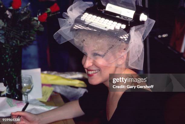 American singer, actress, and author Bette Midler smiles during a book signing at a B Dalton bookseller, New York, New York, May 1, 1980. Midler, who...