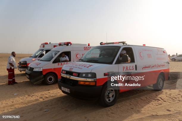 Health crews wait on standby during a demonstration, on the 8th week of the "Great March of Return", at Gaza-Israel border in eastern Rafah, Gaza on...