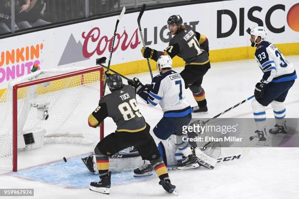 William Karlsson of the Vegas Golden Knights scores a first-period goal past Connor Hellebuyck of the Winnipeg Jets in Game Four of the Western...