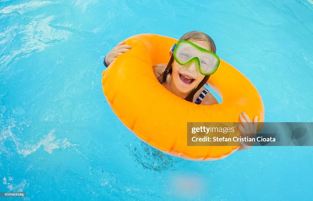 Girl playing in the pool
