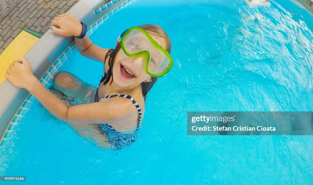 Girl smiling in the pool