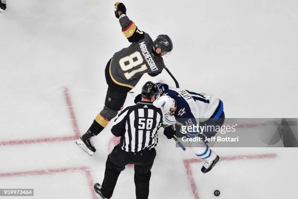 Bryan Little of the Winnipeg Jets takes a faceoff against Jonathan Marchessault of the Vegas Golden Knights in Game Four of the Western Conference...